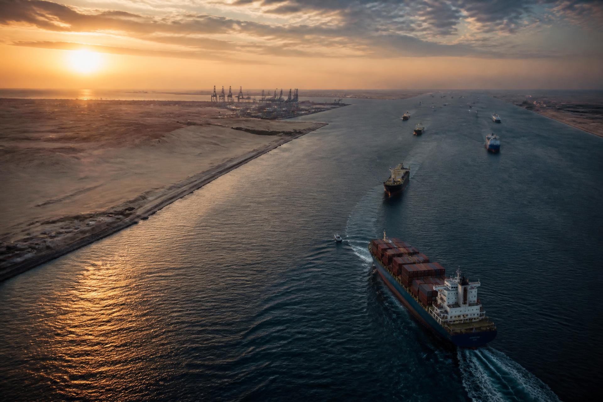 Cargo ships transiting the Red Sea corridor at dusk